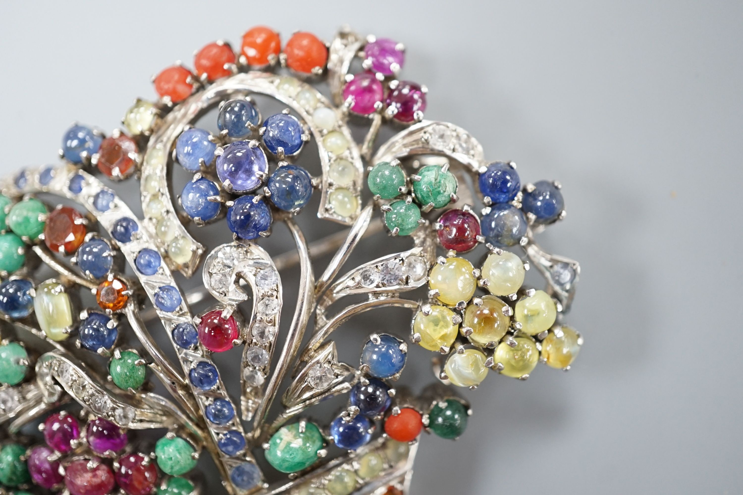 A white metal and multi gem set giardinetto brooch, width 7cm.